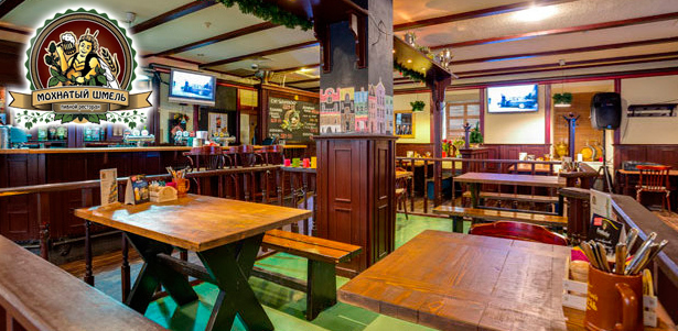 Любые блюда и напитки в ресторане «Мохнатый шмель»: рулька по-баварски, томленая баранья ножка в пряном соусе, стейк из нерки и не только! **Скидка 40%**